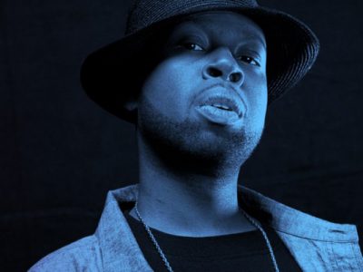 J Dilla wearing hat with blue wash over photo
