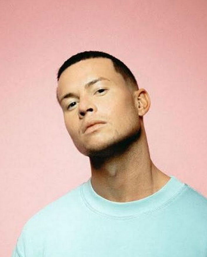 Joel Corry against pink background
