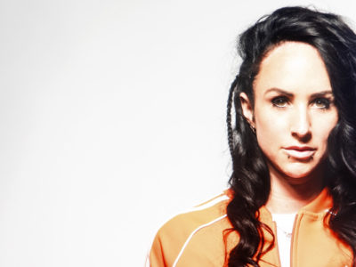 Hannah Wants wearing orange adidas tracktop