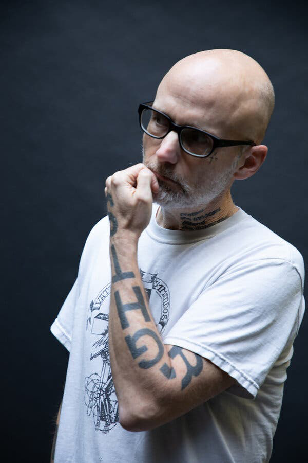 Moby with fist to mouth