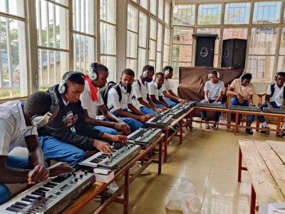 Students with Behringer synths in Rwanda