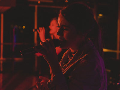 Girl singing into microphone