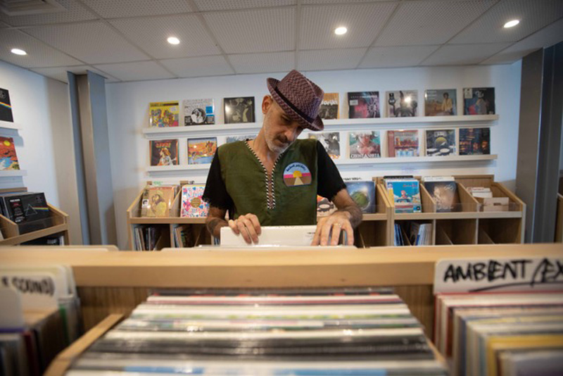 Shadi Megallaa flipping through records at The Flip Side